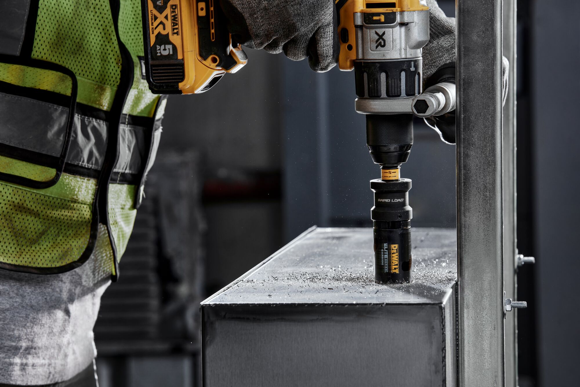 Person using ELITE SERIES Carbide Tipped Holesaw to cut metal